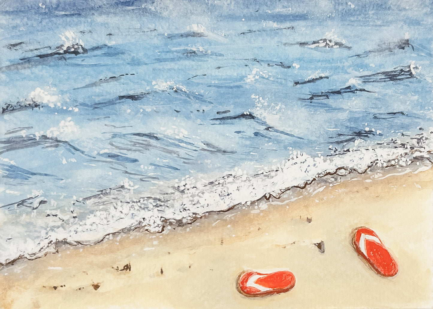 Two red flip-flops on a sandy beach with waves in the background