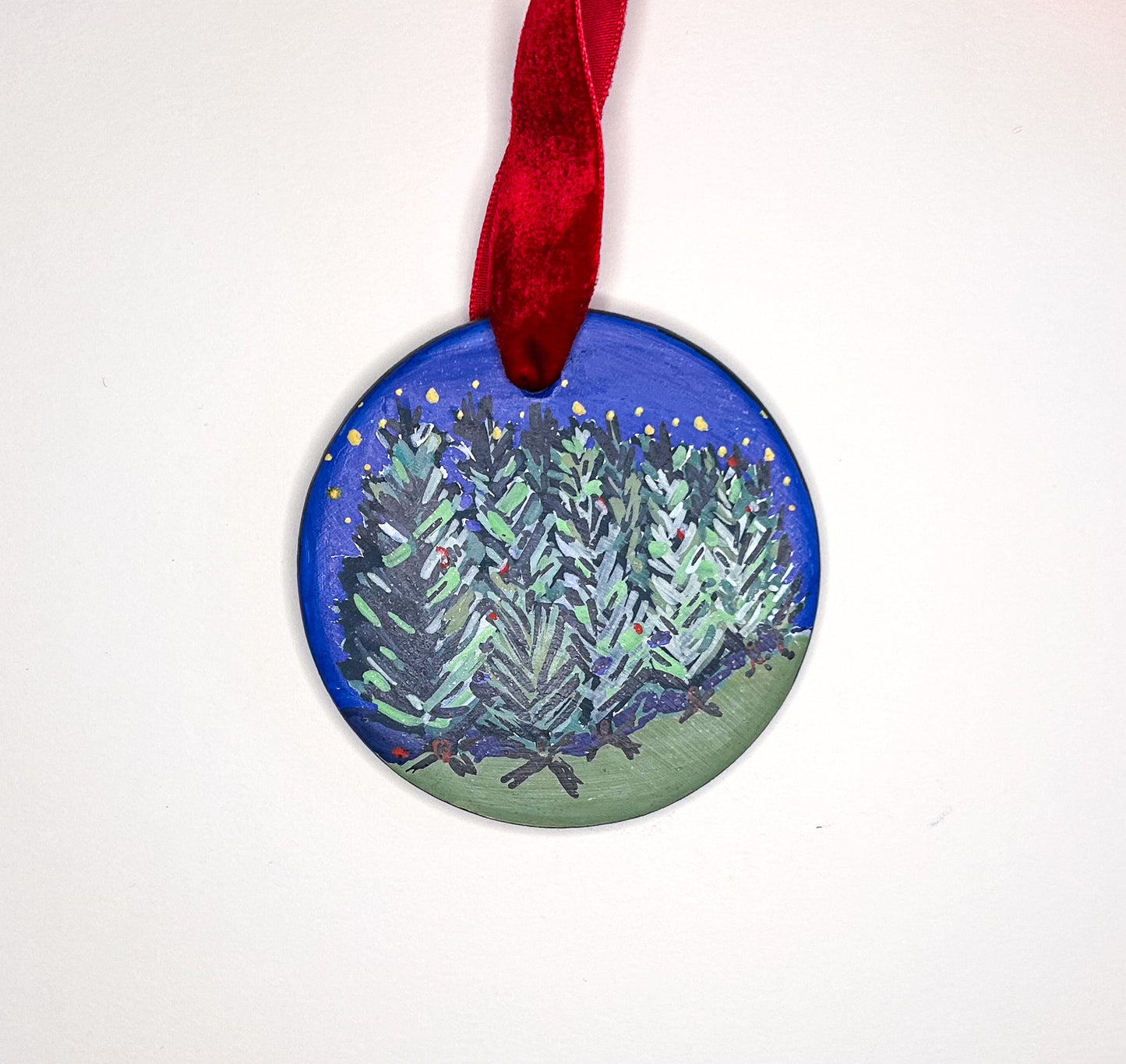 Original hand-painted decorative ornament with a painted Christmas tree design on a white background