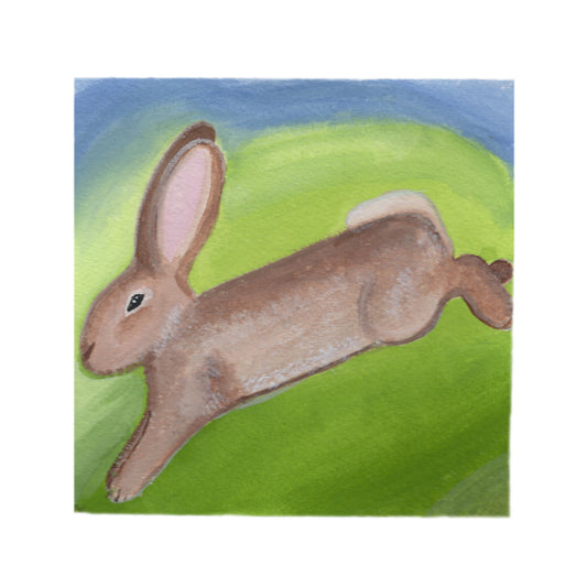Gouache and colored pencil illustration of a small bunny mid-leap through soft grass, surrounded by warm light.